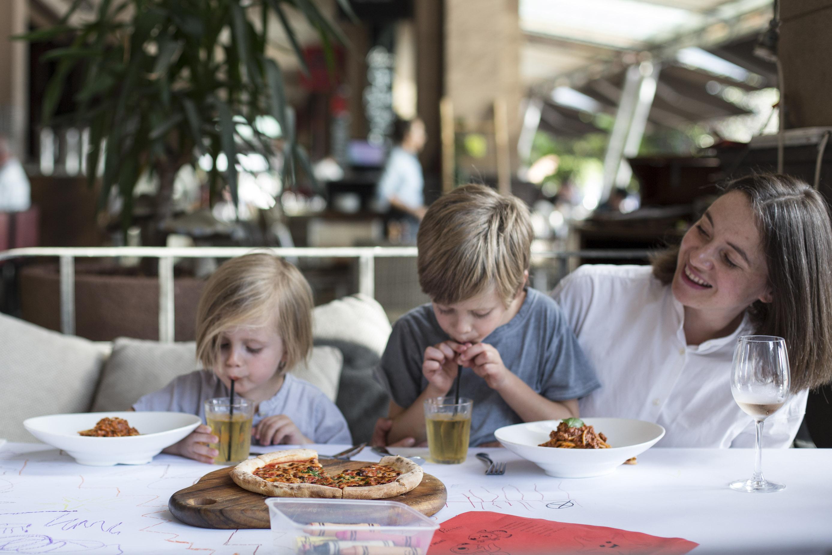 Mother dining with two children at Adria Bar Restaurant Cockle Bay Wharf